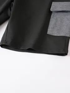 Dettaglio pantaloncini cargo neri primo piano tasca tessuto contrasto casual estate uomo abbigliamento
