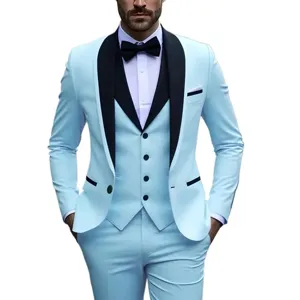 Close-up detail of light blue men's three-piece suit with black shawl lapels and bow tie.