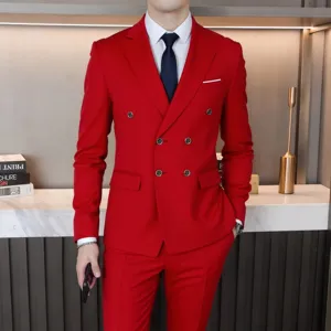 Details of the red double-breasted men suit, close-up view showing tailoring and fit in scene.