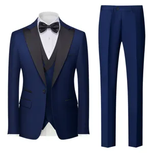Details of the men's blue three-piece tuxedo suit showing fine fabric and tailored slim fit.