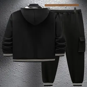 Detailed view of casual black hooded tracksuit with cargo pockets and striped cuffs.