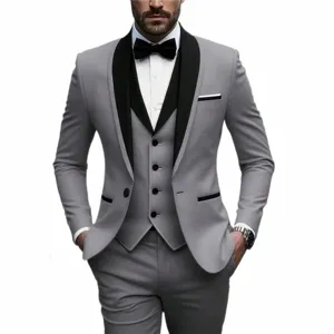 Men's business casual suit set slim fit tuxedo jacket vest and trousers detail view.