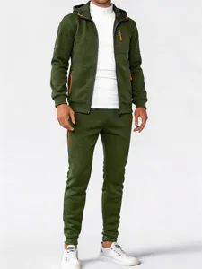 Men's green athletic zip hoodie and pants detail view showcasing vibrant orange zipper accents.