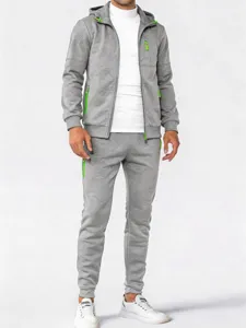 Detail view of men's grey zip hoodie and joggers set with vibrant neon green accents.