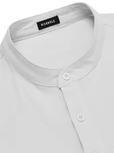 Closeup view of men's casual summer linen mandarin collar shirt with white buttons and brand tag.