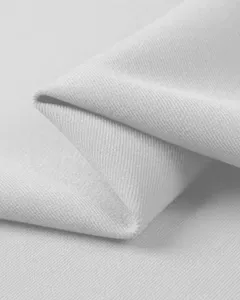 High quality close-up detail of white men polo shirt fabric, showing soft texture weave.