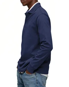 Side detail view of men's long-sleeve polo shirt in solid navy blue with classic lapel collar.