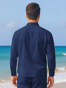 Detail view of mens long sleeve casual solid color linen shirt standing on beach background