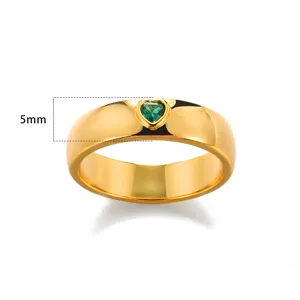 Macro detail of 18K gold plated ring featuring green heart zircon and 5mm band width
