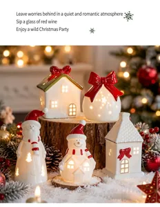 Group of glowing ceramic Christmas houses and snowmen on a snow-covered wooden stump.