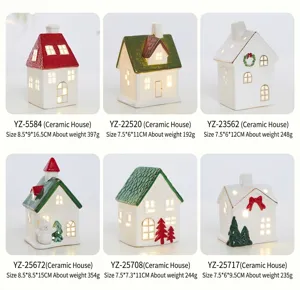 Detailed view of six miniature ceramic Christmas glowing houses with various designs.