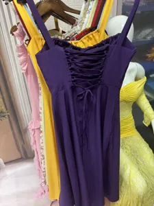 Detailed view of the purple midi dress featuring a sexy lace-up corset back design.