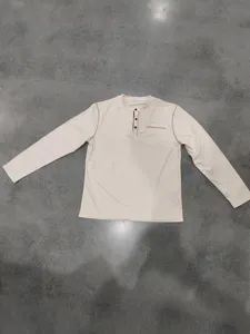 Men's long sleeve casual Henley shirt with button placket and chest pocket for spring.