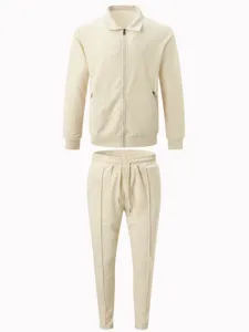 Men's waffle knit zip jacket and pants tracksuit detail, beige casual sportswear set.