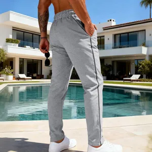 Detail view of men's casual straight-leg sweatpants in gray, perfect for sports and daily wear.