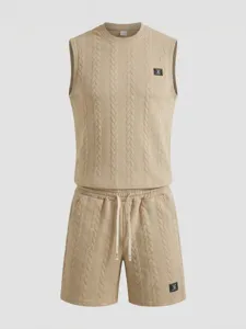 Close-up detail of knitted jacquard sleeveless vest and shorts lounge set in beige.