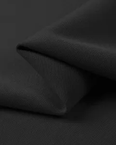Detailed view of premium black fabric with clear twill texture, soft touch and durable quality.