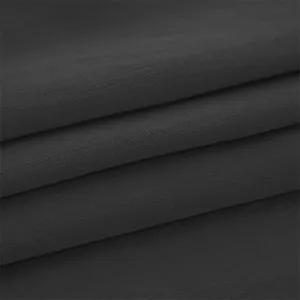 Dark grey fabric texture detail closeup, soft material swatch showing fine weaving pattern.
