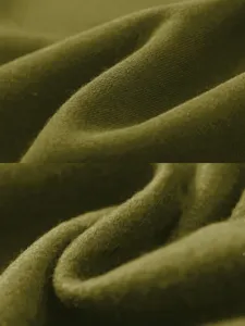 Close-up detail of dark olive green fleece fabric showing soft texture and natural folds.