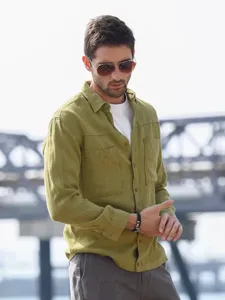Men's olive green long sleeve utility shirt with dual chest pockets, casual streetwear style.