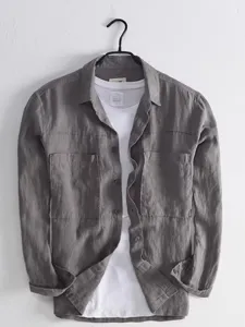 Detailed view of the dark grey utility long sleeve shirt with dual chest pockets and inner tee.