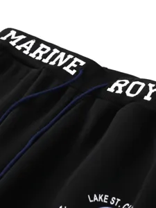 Black casual pants waist detail showcase with white text print and blue drawstring.