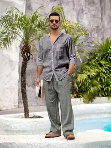 Men's linen long sleeve shirt and casual pants set, breathable resort wear outfit detail.