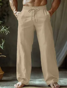 Detail shot of men's casual khaki linen trousers with elastic drawstring and relaxed straight fit.