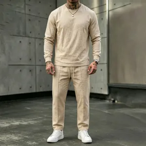 Detailed view of men's casual long sleeve linen crewneck top and pants set in beige.