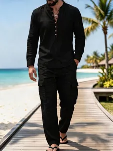 Detailed view of casual long-sleeve linen shirt and cargo pants on beach boardwalk.