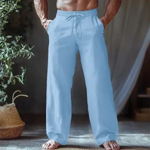 Detailed view of men casual light blue linen trousers showing soft fabric and elastic drawstring waist.