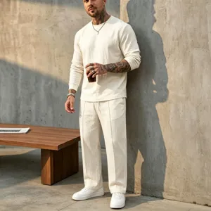 Detailed view of men's casual linen long sleeve crewneck top and matching pants set.