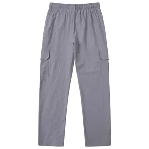 Men's casual linen cargo pants detail showing breathable multi-pocket design and elastic waist.