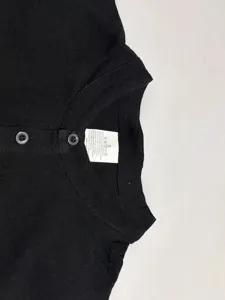 Black linen blend shirt collar detail view showing button closure and size tag inside.