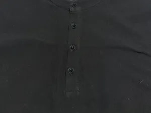 Close-up detail shot of the black men shirt placket and stylish collar with buttons.