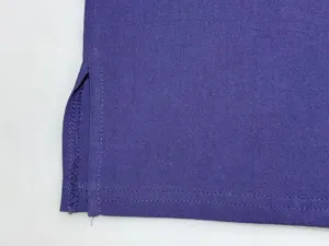Purple fabric detail shot showing the side slit and fine stitching craftsmanship.