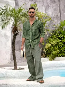 Detail shot of casual men's linen long-sleeve shirt and matching trousers outfit.