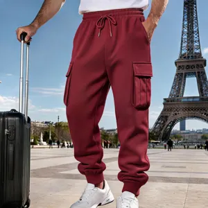 Men's fleece lined burgundy cargo sweatpants detail view, casual outdoor travel style outfit.