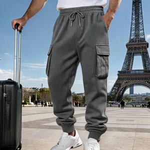 Detail view of men's casual fleece-lined cargo sweatpants in dark grey with pockets.