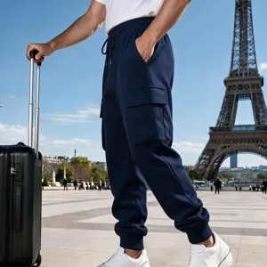Close-up detail view of men's casual cargo sweatpants featuring elastic cuffs and pockets.