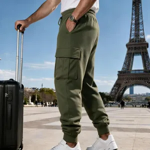 Outdoor detail view of men's fleece-lined olive cargo joggers with side pockets and cuffs.