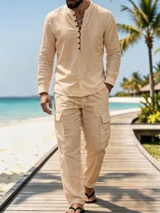Detailed view of the casual linen shirt and cargo pants set on a scenic beach boardwalk.
