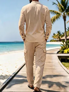 Men's casual linen look long sleeve shirt and cargo pants detail showing beach style background.