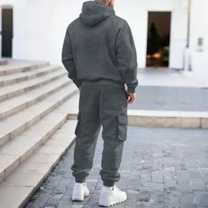Detailed back view of men's solid gray hooded sweatshirt and cargo sweatpants set outdoors.