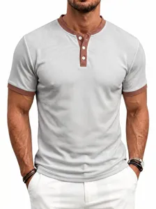 Detail shot of men's waffle knit Henley shirt, contrast color collar and cuffs, short sleeves.