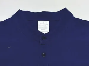 Dark blue linen blend shirt collar detail, featuring front buttons and washing label.