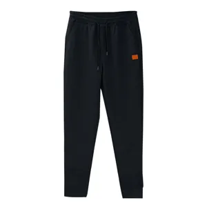 Pantalon de jogging noir en maille pour homme confortable avec cordon de serrage et patch.