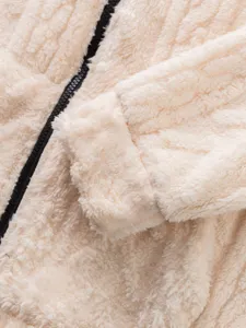 Close-up detail of mens cream fleece zip hoodie featuring soft sherpa fabric and black zipper.