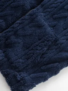 Men's navy blue fleece zip hoodie detail shot, cozy winter fuzzy knitwear outerwear piece.