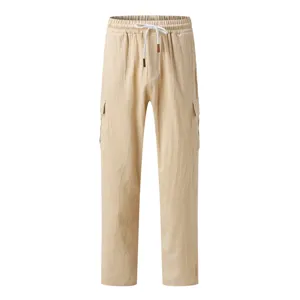 Detailed view of men's beige casual cargo trousers featuring an elastic drawstring waist.